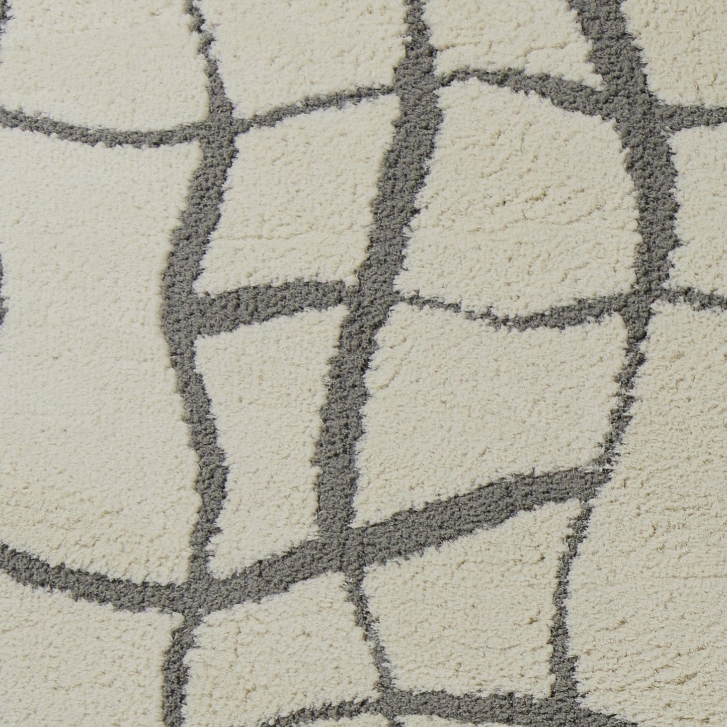 5'X7' Ivory Machine Woven Abstract Indoor Shag Rug