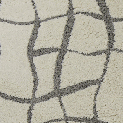 5'X7' Ivory Machine Woven Abstract Indoor Shag Rug