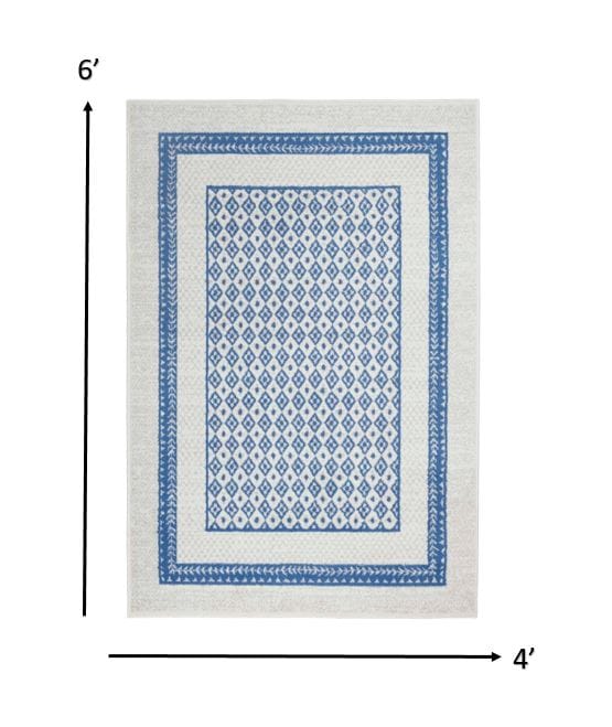4’ X 6’ Ivory And Blue Geometric Area Rug