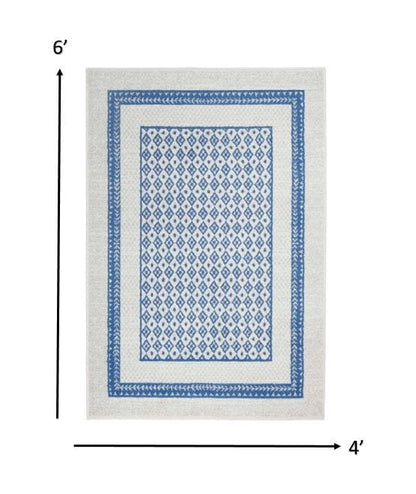 4’ X 6’ Ivory And Blue Geometric Area Rug