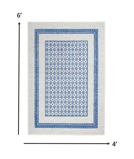 4’ X 6’ Ivory And Blue Geometric Area Rug