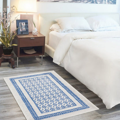 4’ X 6’ Ivory And Blue Geometric Area Rug