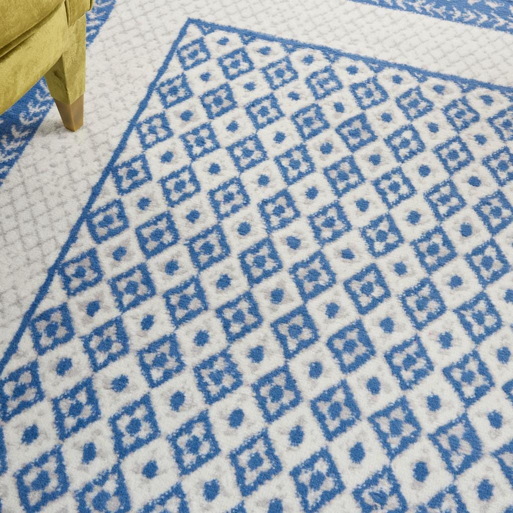 4’ X 6’ Ivory And Blue Geometric Area Rug