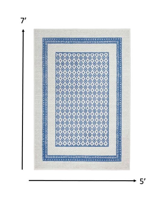 4’ X 6’ Ivory And Blue Geometric Area Rug