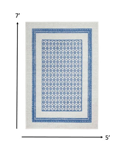4’ X 6’ Ivory And Blue Geometric Area Rug