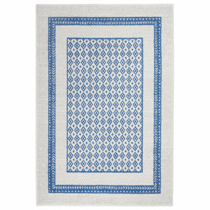 4’ X 6’ Ivory And Blue Geometric Area Rug