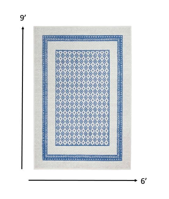 4’ X 6’ Ivory And Blue Geometric Area Rug