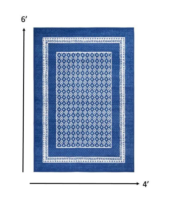 4’ X 6’ Navy And Ivory Geometric Area Rug