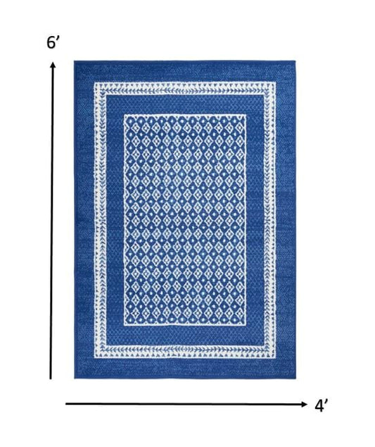 4’ X 6’ Navy And Ivory Geometric Area Rug