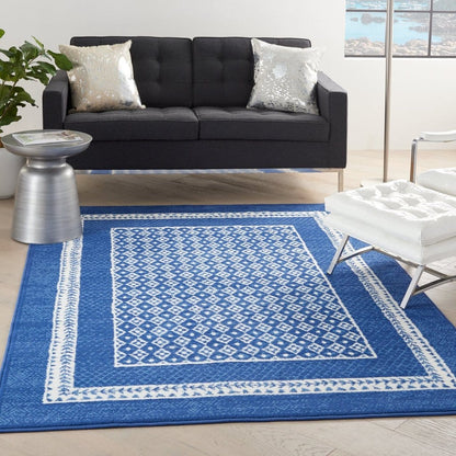 4’ X 6’ Navy And Ivory Geometric Area Rug