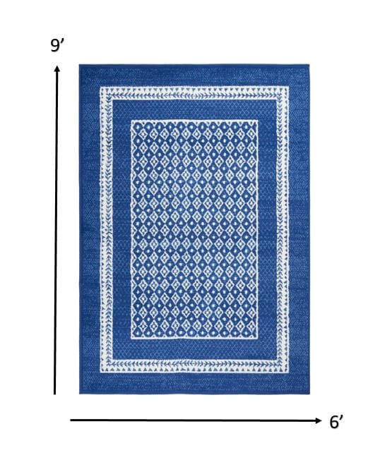 4’ X 6’ Navy And Ivory Geometric Area Rug