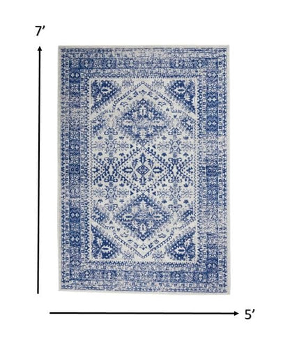 4’ X 6’ Ivory And Navy Geometric Area Rug