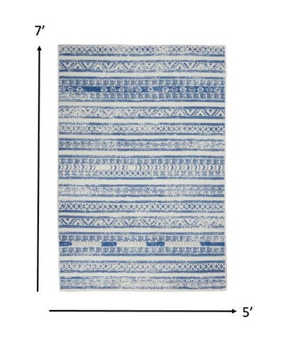 4’ X 6’ Ivory And Blue Distressed Area Rug