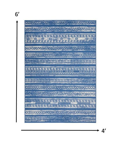 4’ X 6’ Ivory And Blue Distressed Area Rug