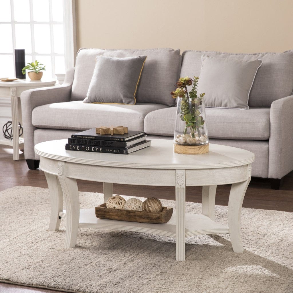 44" White Manufactured Wood And Metal Oval Coffee Table