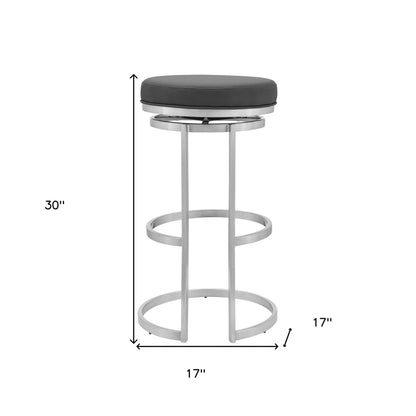 30" Gray Faux Leather And Iron Swivel Backless Bar Height Chair