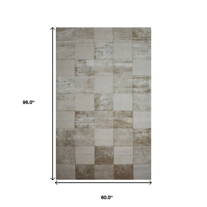 5' X 8' Beige Geometric Hand Woven Stain Resistant Area Rug