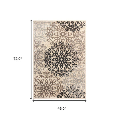 4' X 6' Tan Gray And Black Floral Medallion Stain Resistant Area Rug