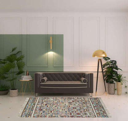 5' X 8' Ivory Blue Pink Gold And Green Geometric Hand Woven Area Rug With Fringe