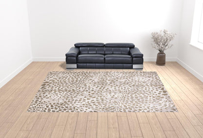 5' X 8' Brown And Ivory Abstract Stain Resistant Area Rug