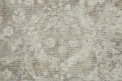 5' X 8' Ivory And Tan Abstract Hand Woven Area Rug