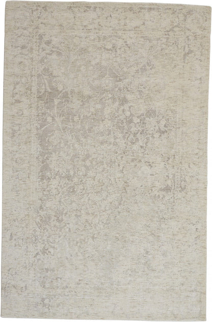 5' X 8' Ivory And Tan Abstract Hand Woven Area Rug