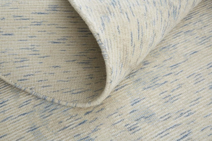 5' X 8' Ivory And Tan Abstract Hand Woven Area Rug