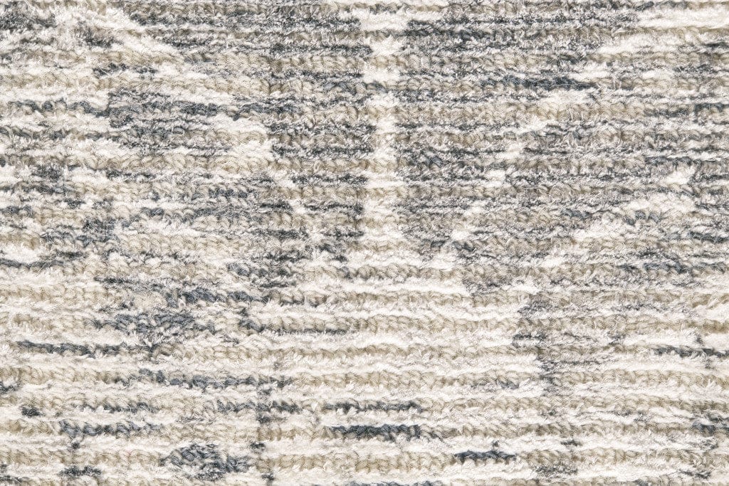 5' X 8' Ivory And Tan Abstract Hand Woven Area Rug