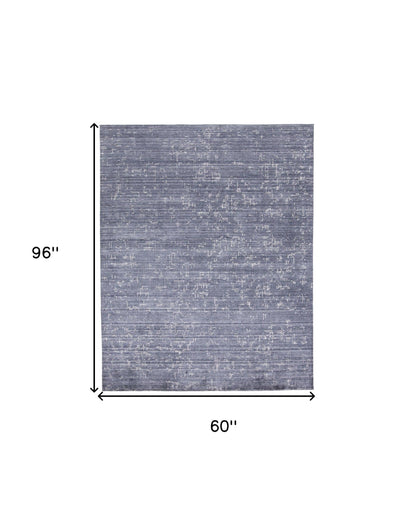 4' X 6' Blue And Ivory Abstract Hand Woven Area Rug