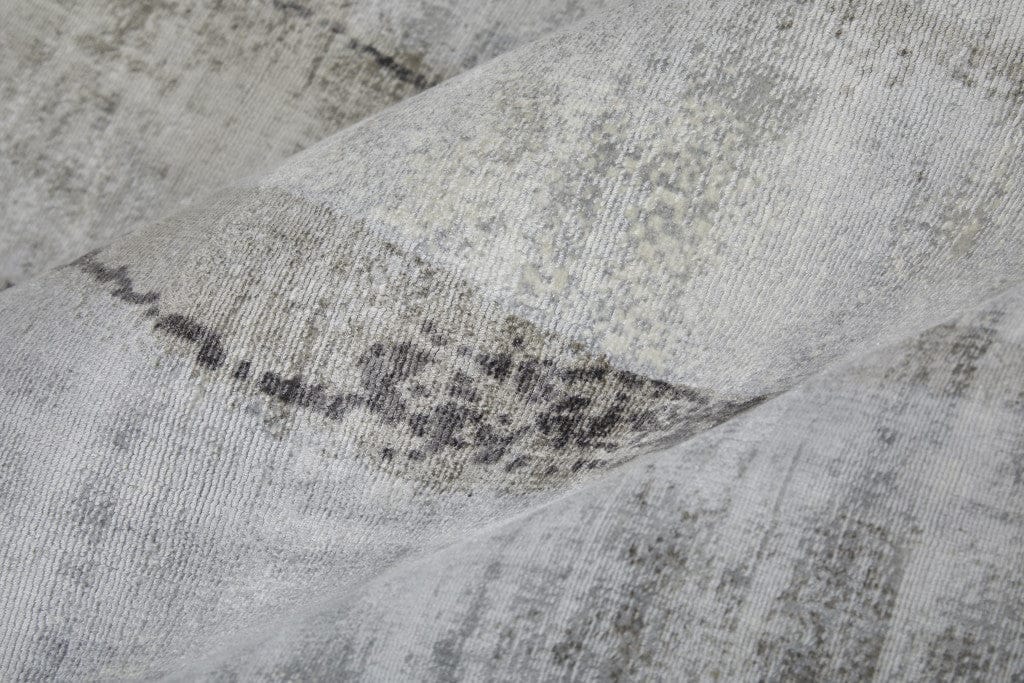 5' X 8' Gray Taupe And Ivory Abstract Hand Woven Area Rug