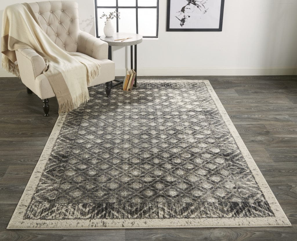 4' X 6' Ivory Black And Taupe Abstract Stain Resistant Area Rug