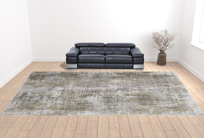 3' X 5' Green Gray And Ivory Abstract Power Loom Distressed Area Rug With Fringe