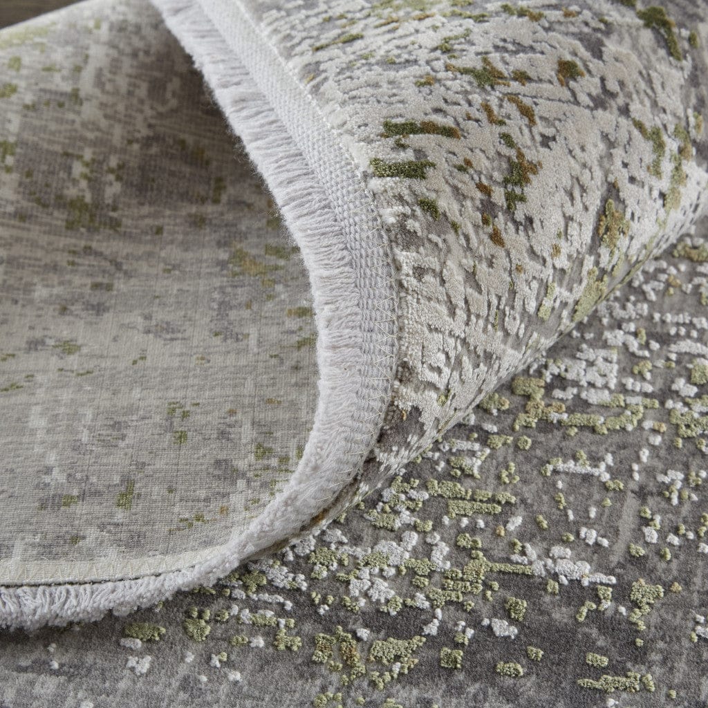 3' X 5' Green Gray And Ivory Abstract Power Loom Distressed Area Rug With Fringe