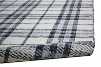 4' X 6' Blue Green And Black Abstract Hand Woven Stain Resistant Area Rug