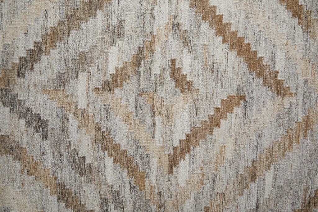 4' X 6' Ivory Gray And Tan Geometric Hand Woven Stain Resistant Area Rug With Fringe