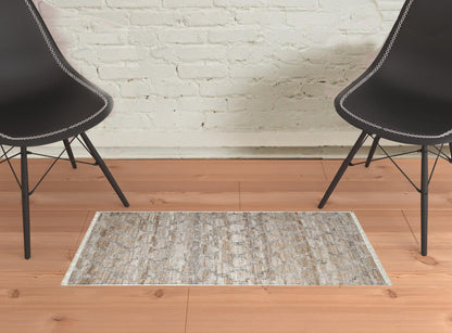 4' X 6' Tan Gray And Ivory Geometric Hand Woven Stain Resistant Area Rug With Fringe