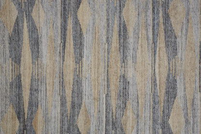 5' X 8' Gray Tan And Silver Abstract Hand Woven Stain Resistant Area Rug With Fringe