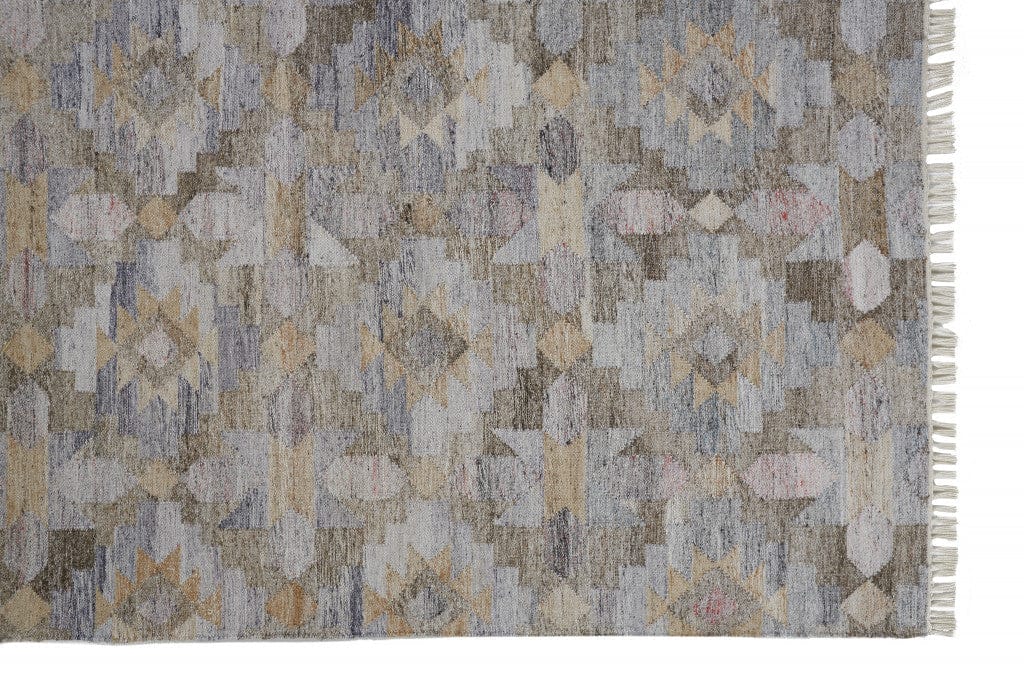 4' X 6' Taupe Gray And Blue Geometric Hand Woven Stain Resistant Area Rug With Fringe
