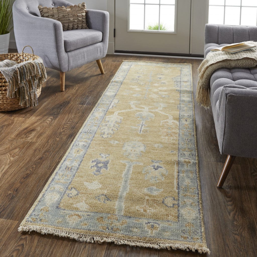 4' X 6' Gold Blue And Gray Wool Floral Hand Knotted Stain Resistant Area Rug With Fringe