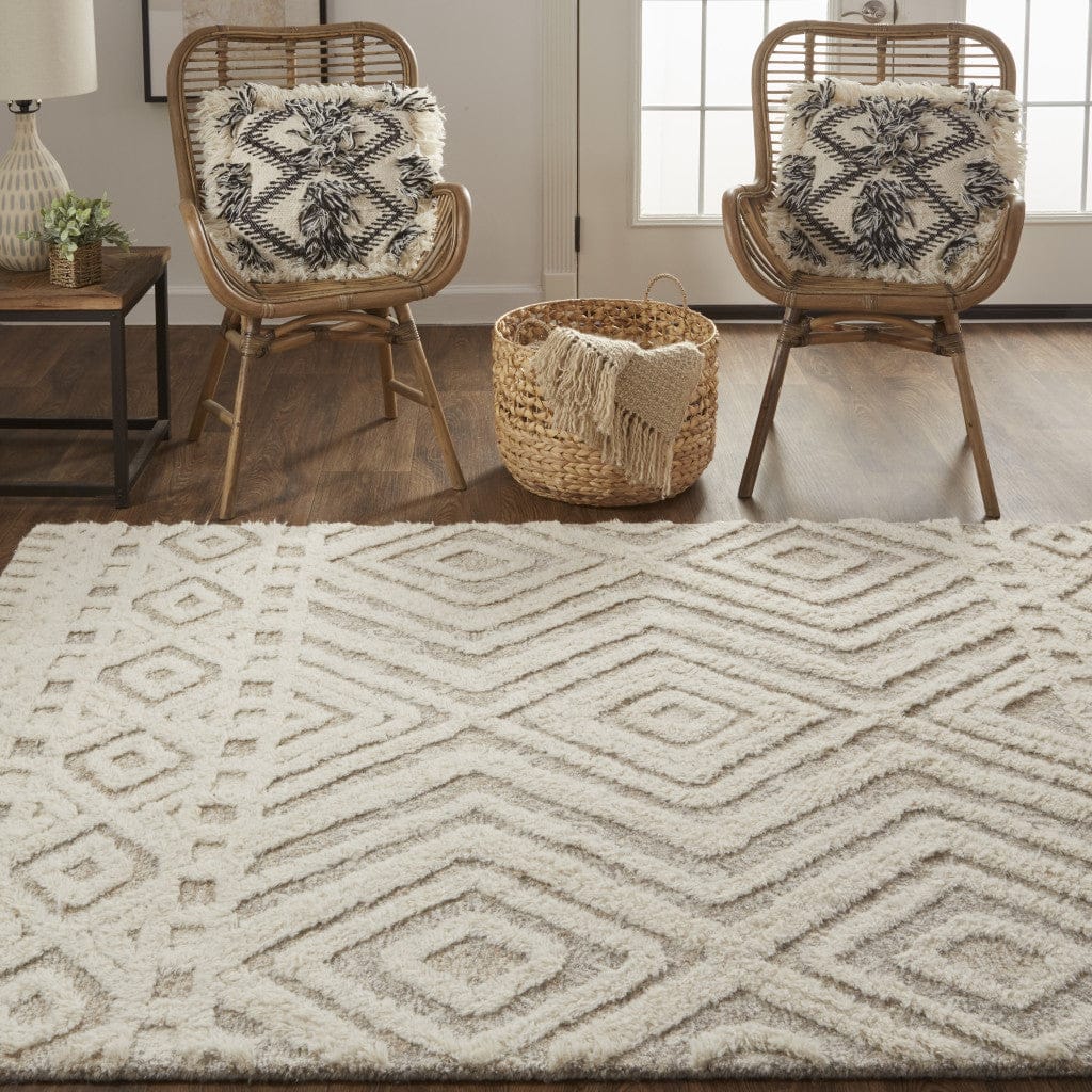 4' X 6' Ivory And Tan Wool Geometric Tufted Handmade Stain Resistant Area Rug