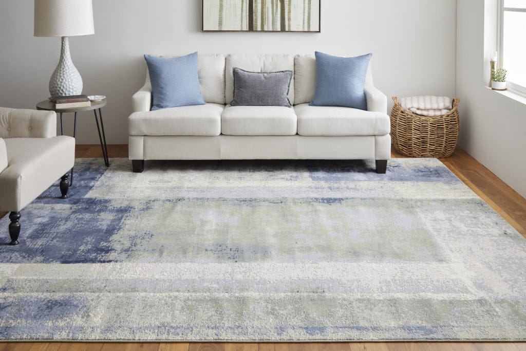 4' X 6' Blue Green And Ivory Abstract Power Loom Distressed Area Rug