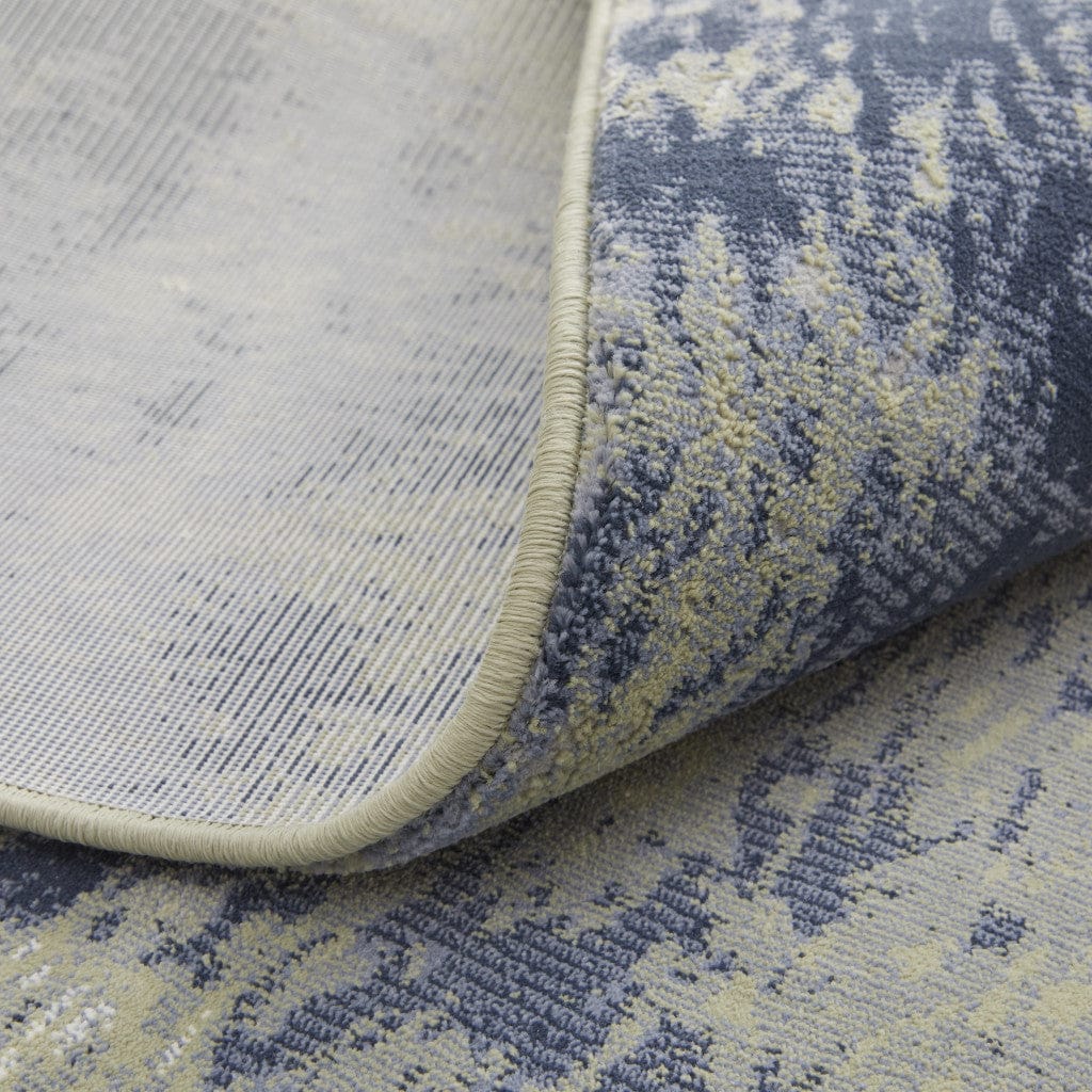 4' X 6' Blue Green And Ivory Abstract Power Loom Distressed Area Rug