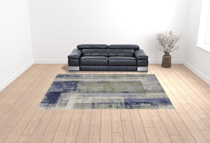 4' X 6' Blue Green And Ivory Abstract Power Loom Distressed Area Rug