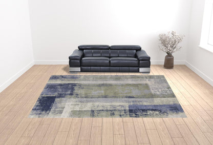 4' X 6' Blue Green And Ivory Abstract Power Loom Distressed Area Rug