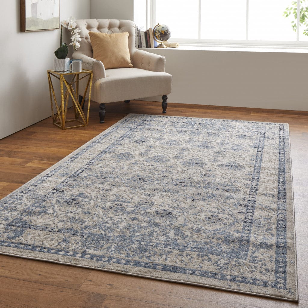 4' X 6' Blue And Ivory Geometric Power Loom Distressed Area Rug