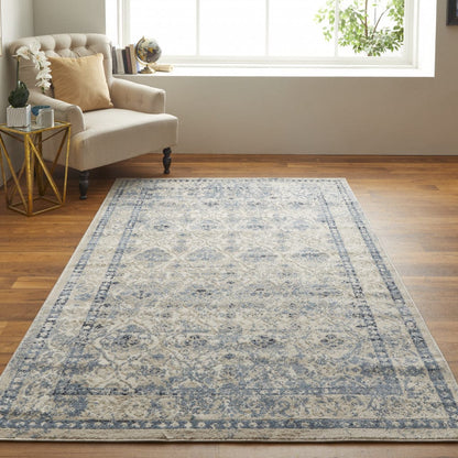 4' X 6' Blue And Ivory Geometric Power Loom Distressed Area Rug