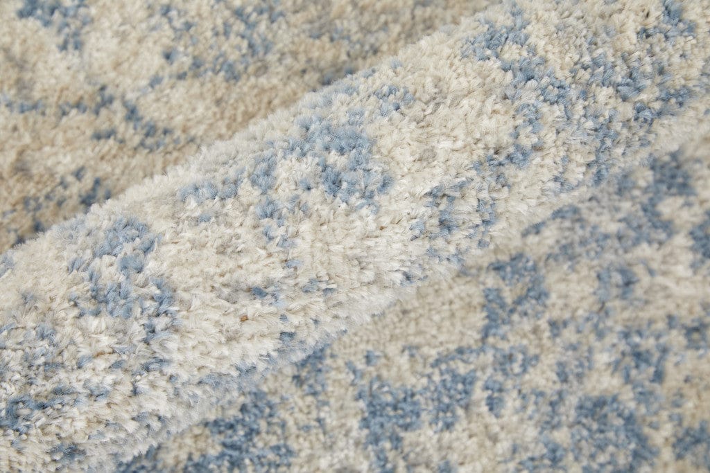 4' X 6' Blue And Ivory Abstract Power Loom Distressed Area Rug