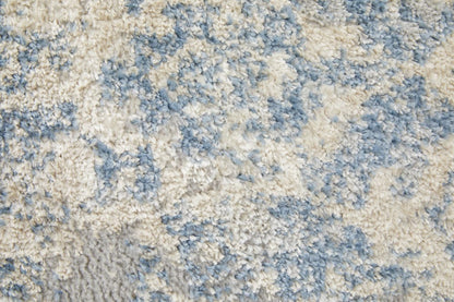 4' X 6' Blue And Ivory Abstract Power Loom Distressed Area Rug