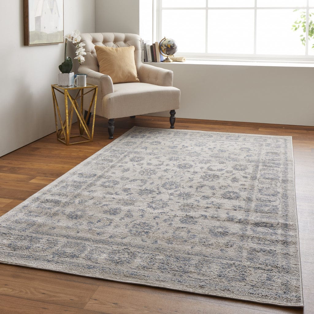 4' X 6' Ivory And Blue Abstract Power Loom Distressed Area Rug