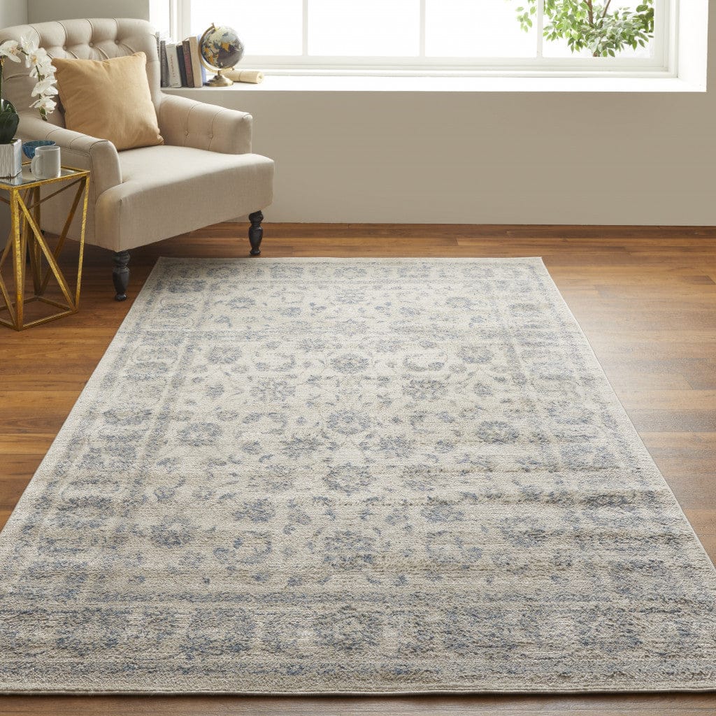 4' X 6' Ivory And Blue Abstract Power Loom Distressed Area Rug